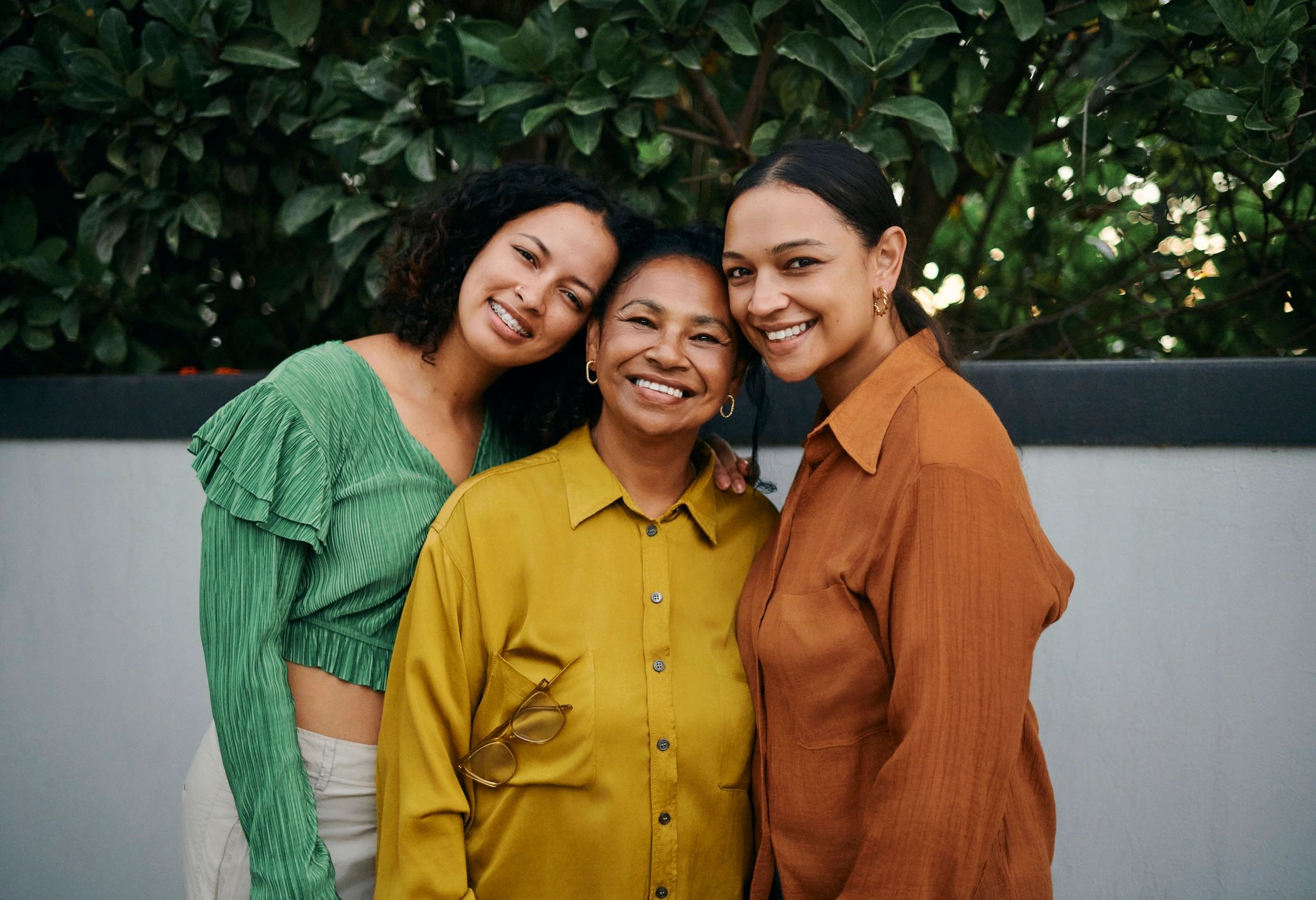 People standing together and smiling in a supportive community setting